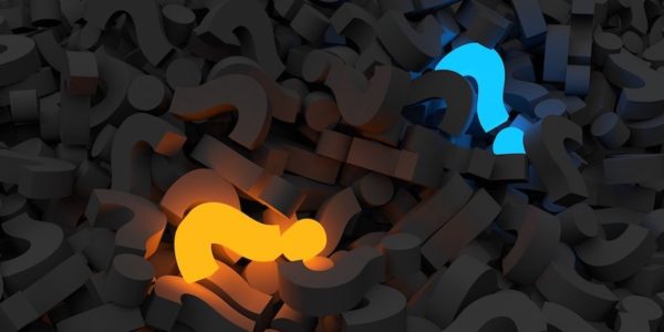 Pile of question marks with two highlighted to represent the accurate answer and buying motive