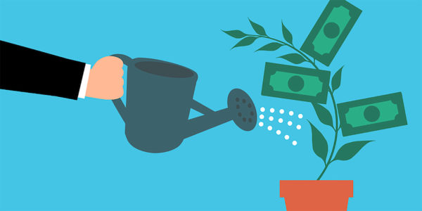 Arm in suit watering money tree to represent revenue enablement