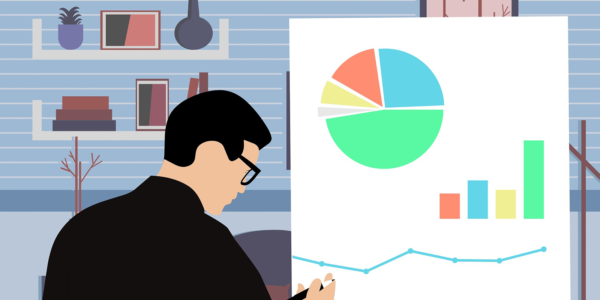 A person standing in front of a presentation board drawing different graphs and charts.