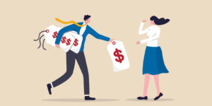 A person in a suite and tie running away with giant price tags.