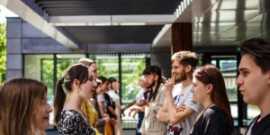A group of people standing outside talking