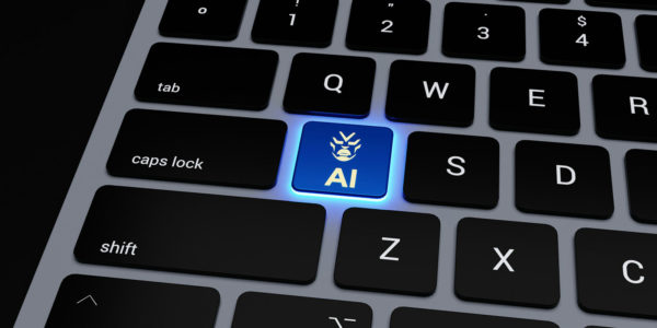AI_keyboard A computer keyboard with AI glowing in blue as a key.