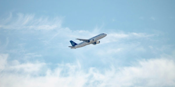 Take_Off An airplane flying in the sky.