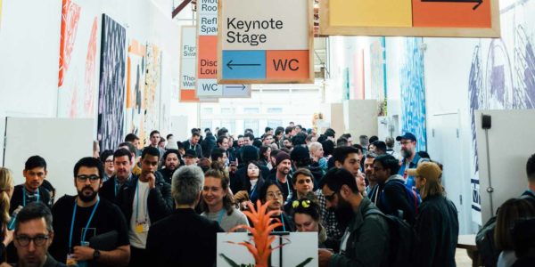 A room of people at a conference.