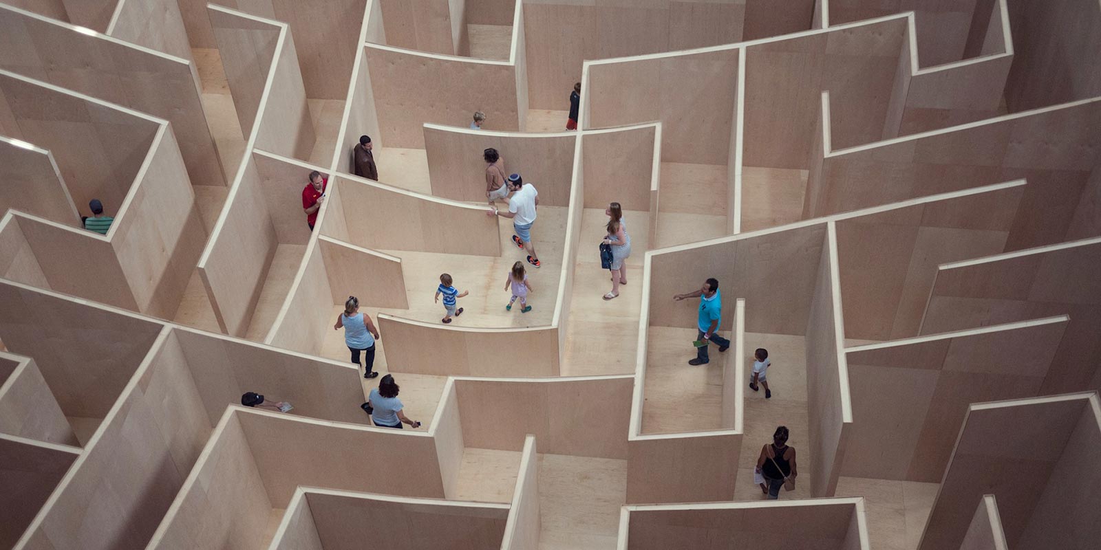 People walking through a maze.