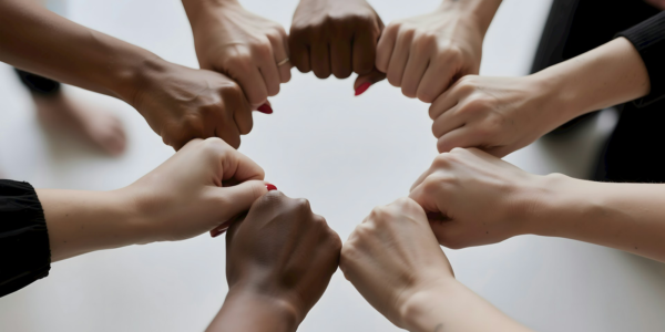 A group of hands making a circle.