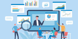 Team collaborating around charts and a virtual presentation screen, analyzing data and discussing insights